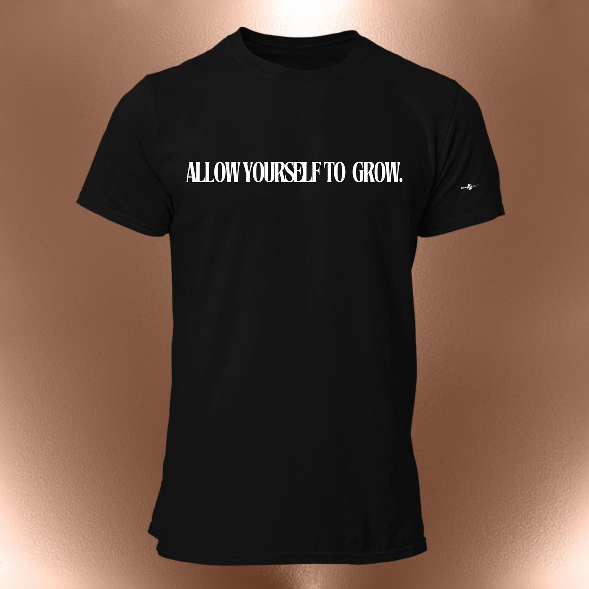 May include: Black t-shirt with the text "ALLOW YOURSELF TO GROW." printed in white on the front.