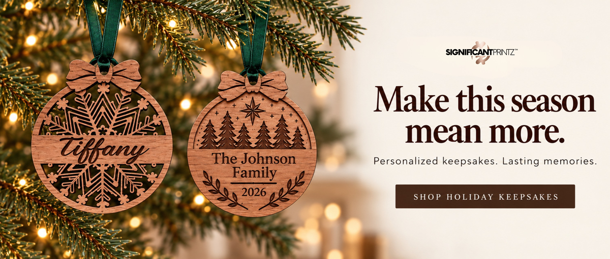 Personalized wooden Christmas ornaments with green ribbons, featuring a name and family keepsake design. Shop holiday keepsakes.