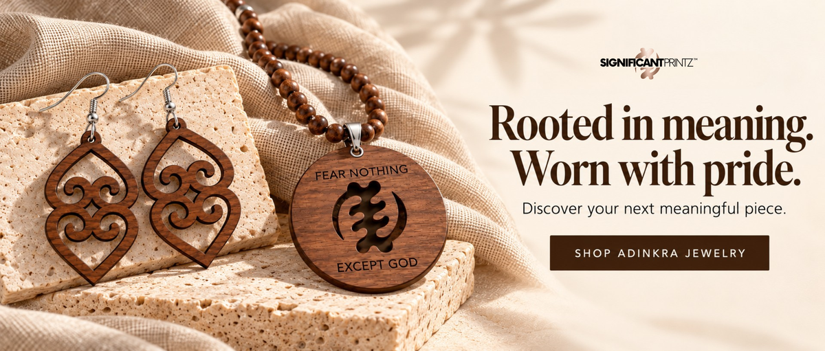 Wooden Adinkra earrings and a beaded necklace with a “Fear Nothing Except God” medallion. Rooted in meaning. Worn with pride. Shop Adinkra jewelry.