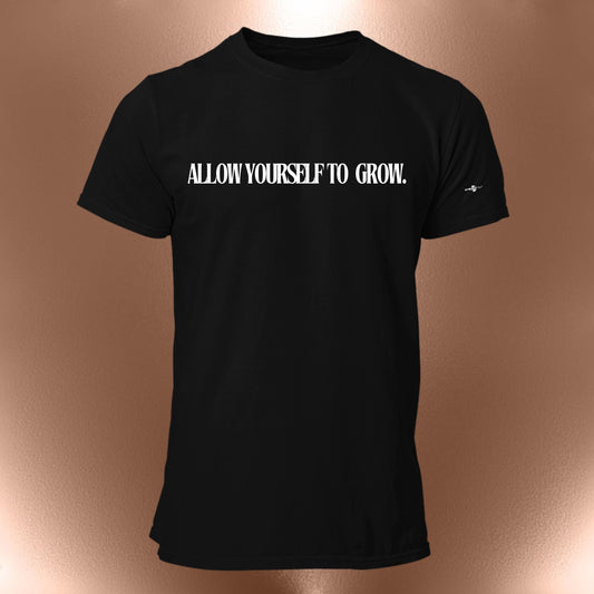 May include: Black t-shirt with the text "ALLOW YOURSELF TO GROW." printed in white on the front.
